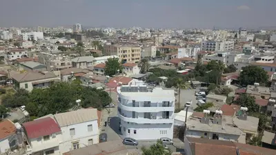 an aerial view of a city with buildings at White 11 in Larnaka