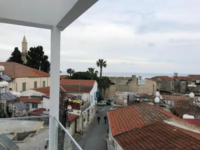 a view of a city street from a balcony at White 11 in Larnaka