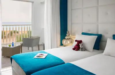 a bedroom with a bed with teddy bears on it at Althea Kalamies Luxury Villas in Protaras