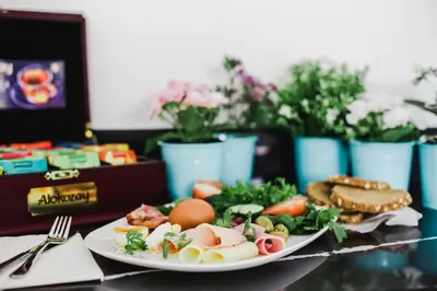 a plate of food with eggs and vegetables on a table at Frangiorgio Hotel in Larnaka