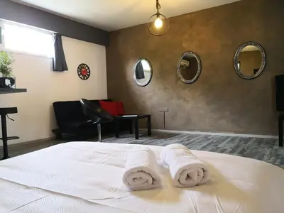 a bedroom with a bed with towels on it at The room in Larnaka