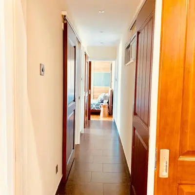 a hallway with a door and a room with the ocean at Modern 2 bed room large apartment in Nicosia