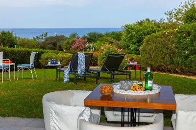 a table and chairs with pumpkins on a patio at Protaras Sirina Waterfront Villa in Protaras
