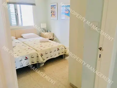 a small room with a bed and a window at Yiallos Village C107 in Larnaka