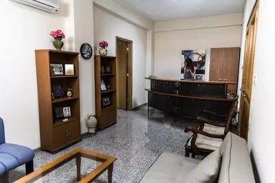 a living room with a couch and a piano at Elysium Capital Residence in Nicosia