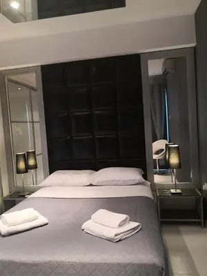 a bedroom with a large bed with two towels on it at Fine Designed Flat 302 in Larnaka