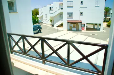 a view of a street from a balcony at Yiallos Village Apt. A101 in Meneou