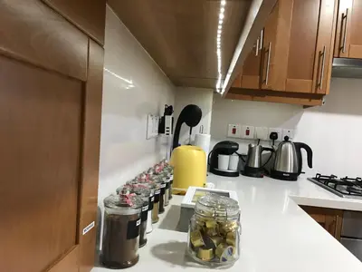 a kitchen with jars of pickles on a counter at Giannoullas Luxury2Bedroom House in Kalopanagiotis in Kalopanayiotis