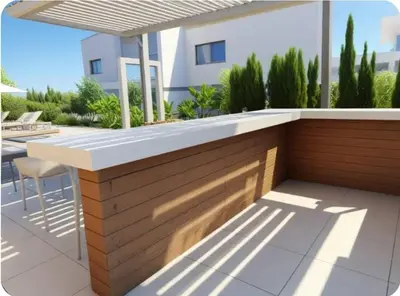 a wooden bar on a patio in front of a house at Seaview Luxury Villas Ayia Napa in Ayia Napa