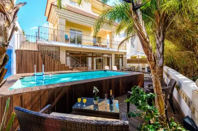 a swimming pool in front of a house at Villa Di Gio in Paralimni
