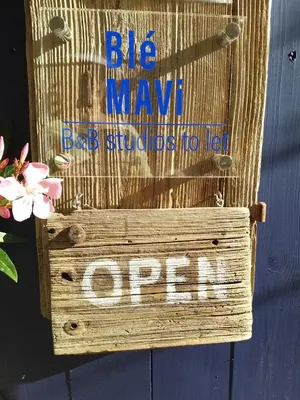 a sign that says big wave back schools to new open at Ble Mavi - Studio for 2 in Vouni