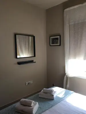 a bedroom with a bed with two towels on it at Ocean View sunny retreat in Protaras