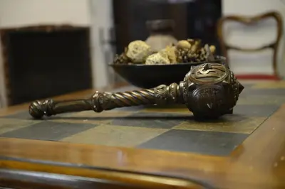 a hammer on a table with a bowl of peanuts at Crambero Suites in Alona