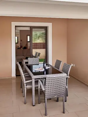 a dining room with a table and chairs at Kyklades Angie Resort in Protaras