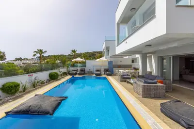 a swimming pool in the backyard of a house at Fig Tree Bay Residences 5 in Protaras