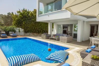 a swimming pool in the backyard of a house at Fig Tree Bay Residences 4 in Protaras