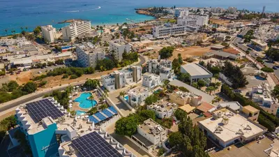 an aerial view of a city with a resort at Fig Tree Bay Residences 6 in Protaras