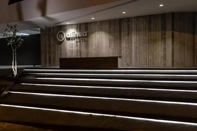 a church with a wooden wall and some stairs at Alinea Suites Limassol Center in Limassol