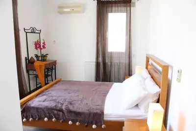 a bedroom with a bed and a window at Elina villa near the sea in Protaras