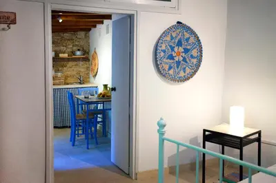 a kitchen with a blue plate on the wall at Cecilias Courtyard in Malia