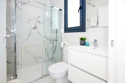 a bathroom with a shower and a toilet and a sink at Villa Mirella in Protaras