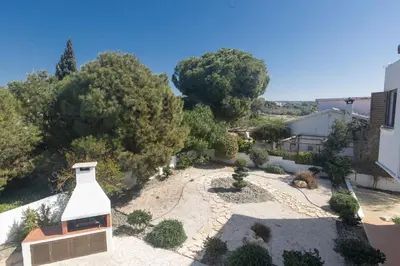 an overhead view of a garden with a building and trees at Rosie Villa in Ayia Napa