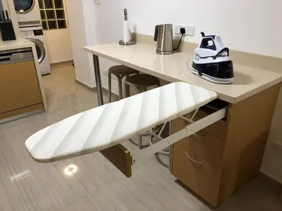 a counter with a white bench in a kitchen at Kennedy Deluxe Suites in Nicosia