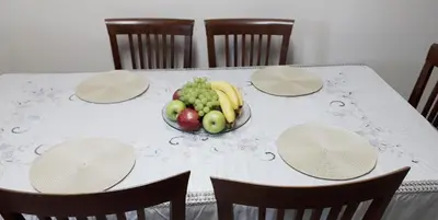 a table with a bowl of fruit on it at Omodos Maria's Apartments in Omodos
