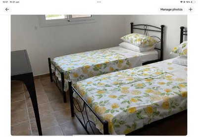 two beds sitting next to each other in a room at Villa Julia in Ayia Napa