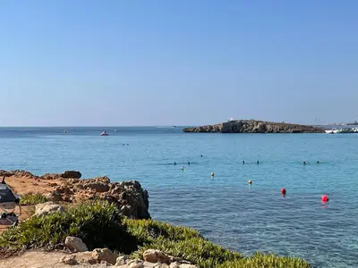 a group of people swimming in a body of water at Villa Julia in Ayia Napa
