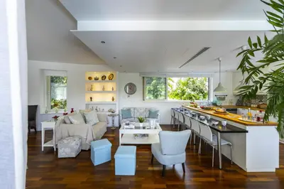 a kitchen and living room with a couch and a table at Larnaca Villa Marisol Kiti in Larnaka