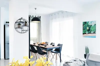 a dining room with a table and chairs at Nissini Nero, 3 bedroom villa with private pool, 5 min to the beach in Ayia Napa