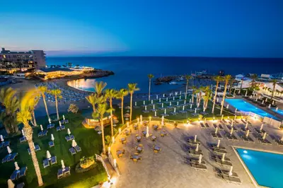 an aerial view of a resort with a pool and the ocean at Infinity Blu - Designed for Adults by Louis Hotels in Protaras