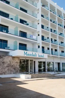 a building with a sign for mandarin hotel at Mandali Hotel in Protaras