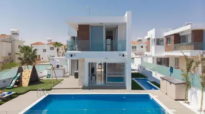 a view of a house with a swimming pool at Villa Lynn Boutique Beachfront in Ayia Napa