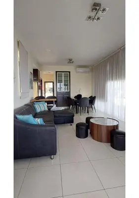 a living room with a couch and a table at Villa Sorelle in Protaras