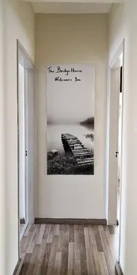 a hallway with a painting on the wall at The Bridge-House Apartment in Nicosia
