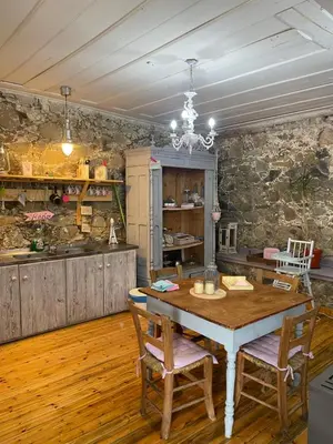 a kitchen and dining room with a table and chairs at Holiday House Prodromos in Prodromos