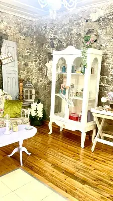 a room with a white cabinet and two tables at Holiday House Prodromos in Prodromos