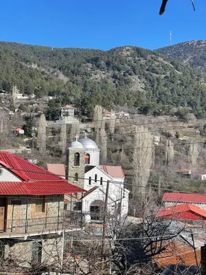 a small village with a church on a hill at Holiday House Prodromos in Prodromos