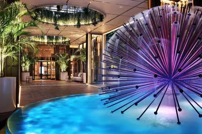 a large purple sculpture in the lobby of a building at Four Seasons Hotel in Limassol