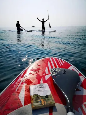two people on a paddle board in the water at CASAVERO in Voroklini