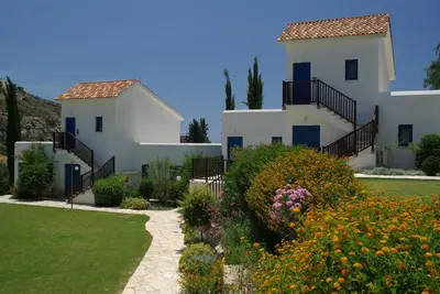 a house with a garden in front of it at Hylatio Tourist Village in Pissouri