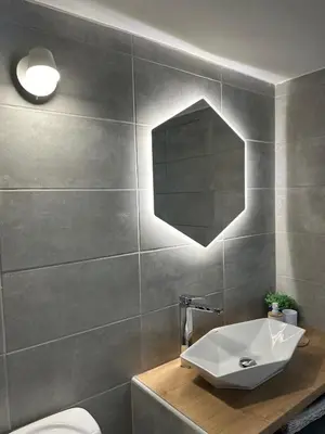 a bathroom with a sink and a mirror at Krasas Beach in Larnaka