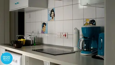 a kitchen with a counter top with a coffee maker at Krasas Beach in Larnaka