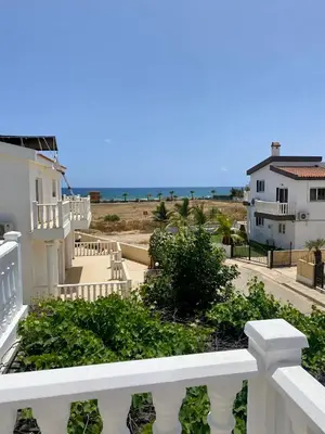 a white balcony with a view of the ocean at Sea View Villa in Agia Thekla in Ayia Napa