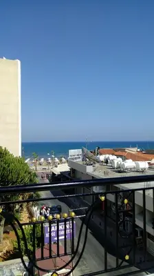 a view of the ocean from a balcony of a hotel at 9 Muses Hotel in Larnaka