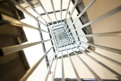 a metal spiral staircase in a building at Jimmy's Suites in Larnaka