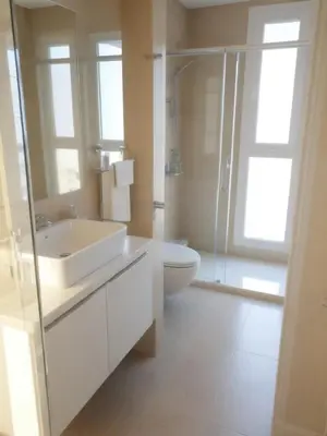 a bathroom with a toilet and a sink and a shower at Napa Hills Seaview Villas in Ayia Napa