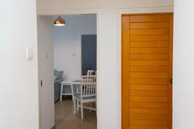 a door leading into a room with a table at White Arches Apt #1 by TrulyCyprus in Limassol